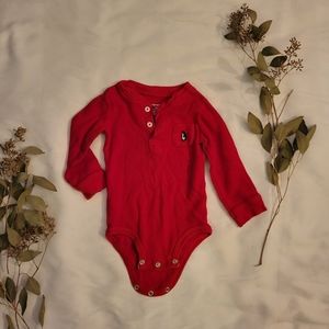 Carter's 18 month red thermal onesie with penguin pocket detail